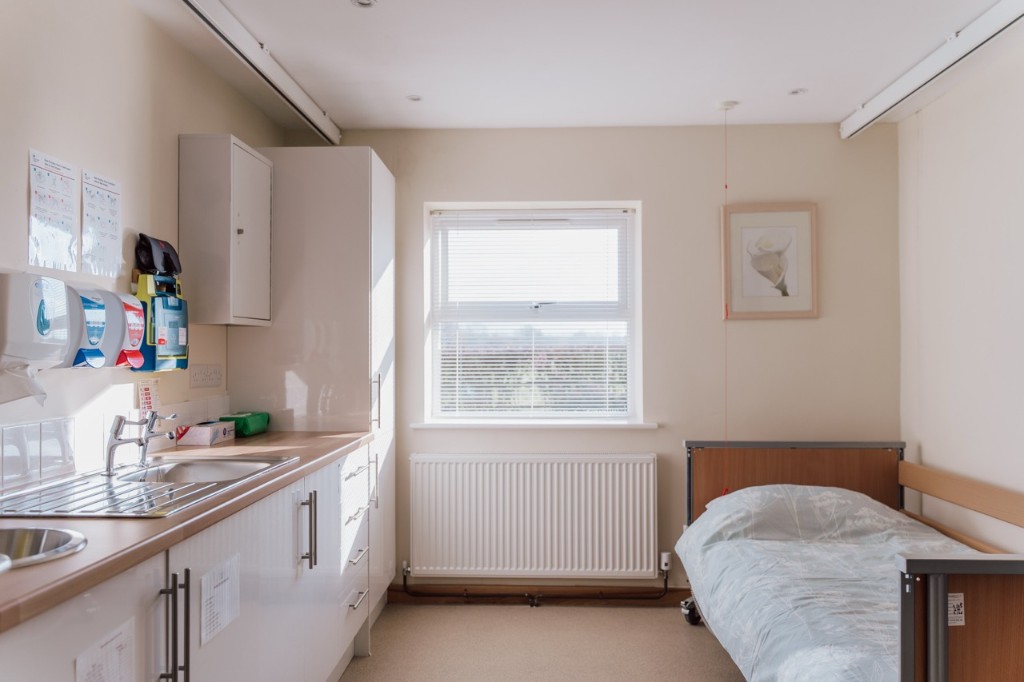Medical room with sink and storage