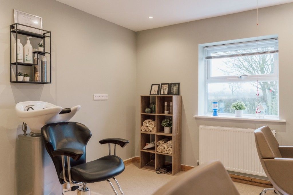 Hair salon wash station and styling chairs