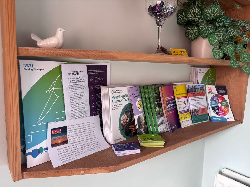 Resource hub shelf with mental health and wellbeing support leaflets