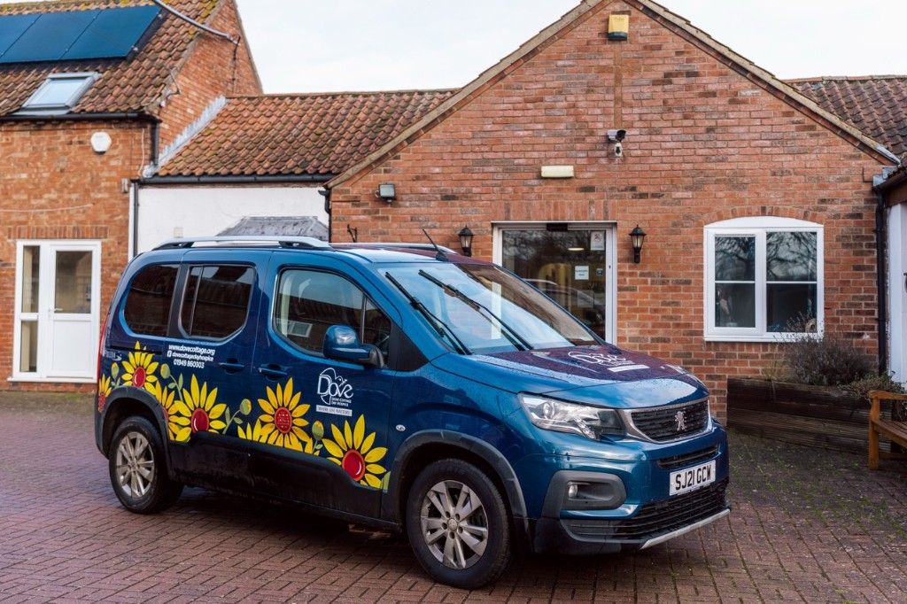 Wheelchair assisted Dove Cottage vehicle supporting access