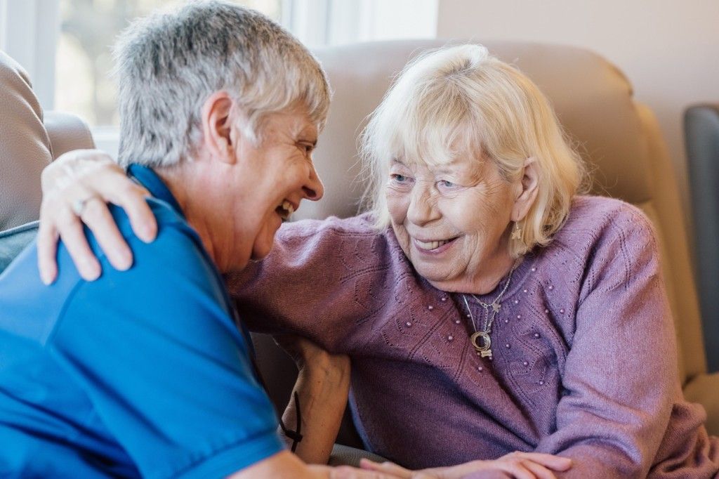 A counsellor and patient sharing a supportive moment