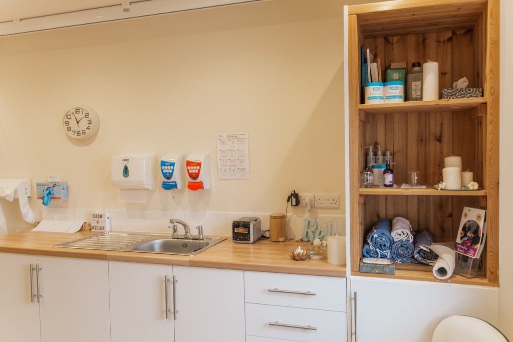 Complementary therapy suite sink and storage area