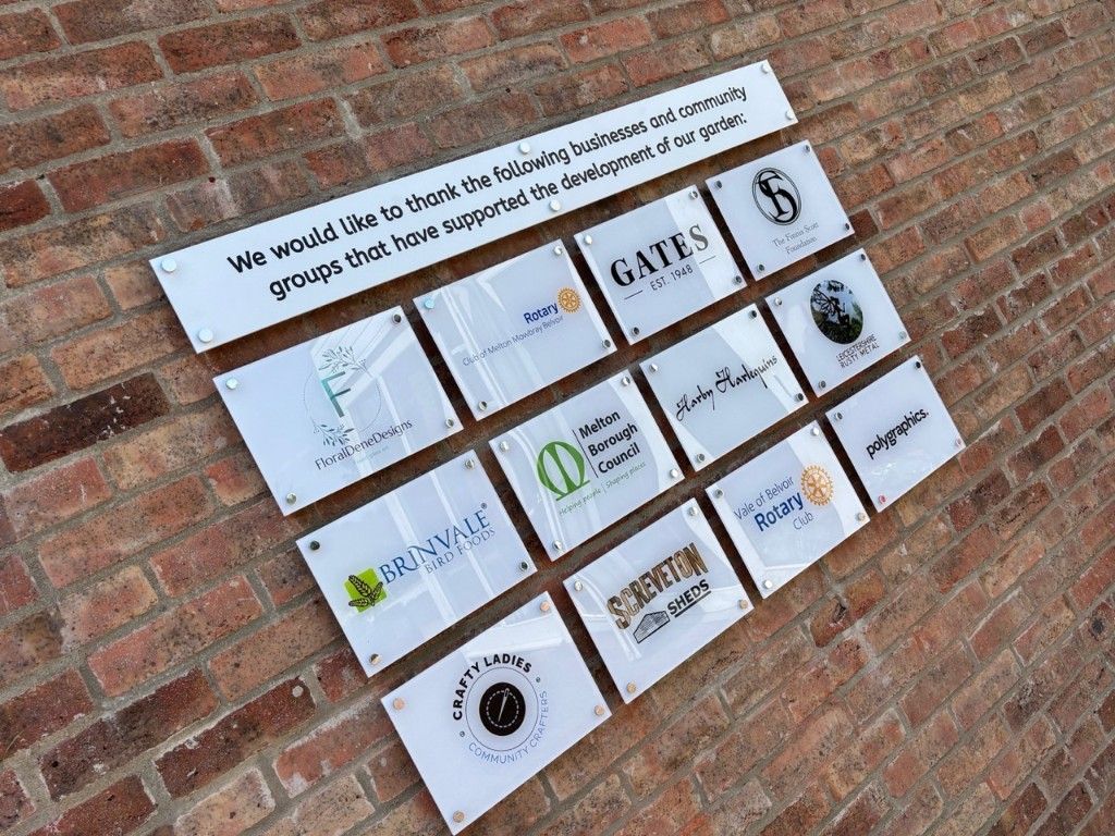 Supporter recognition board displaying local business and community partner logos